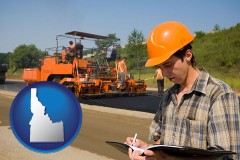 idaho map icon and a paving contractor with paving machinery
