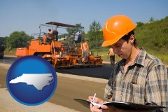 north-carolina map icon and a paving contractor with paving machinery