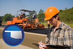 oklahoma map icon and a paving contractor with paving machinery